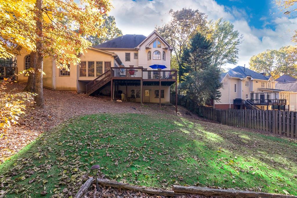 135 Lazy Laurel Chase Roswell, GA 30076 - Photo 9 of 64 a view of a house with a yard porch and sitting area