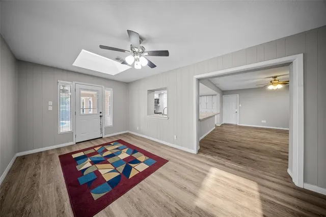 a living room with hard wood floors
