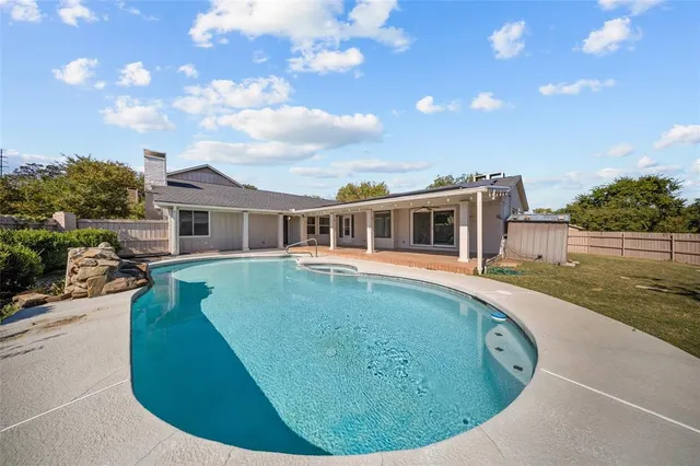 a view of a house with swimming pool