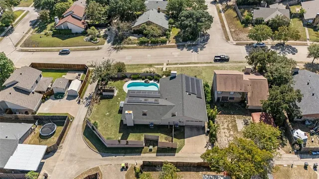 an aerial view of a house with outdoor space