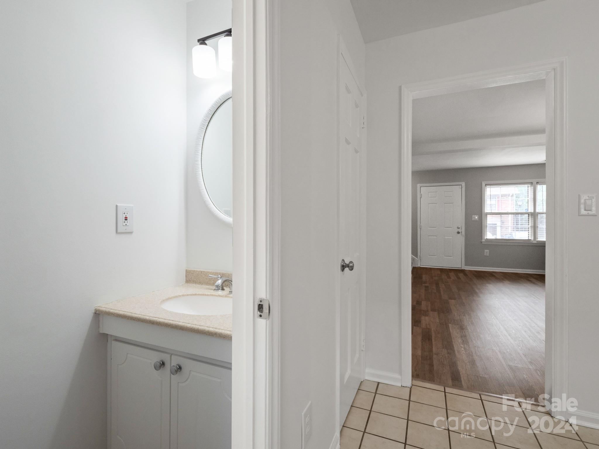 6306 Old Pineville Road, Unit B Charlotte, NC 28217 - Photo 11 of 16 a bathroom with a sink and a mirror