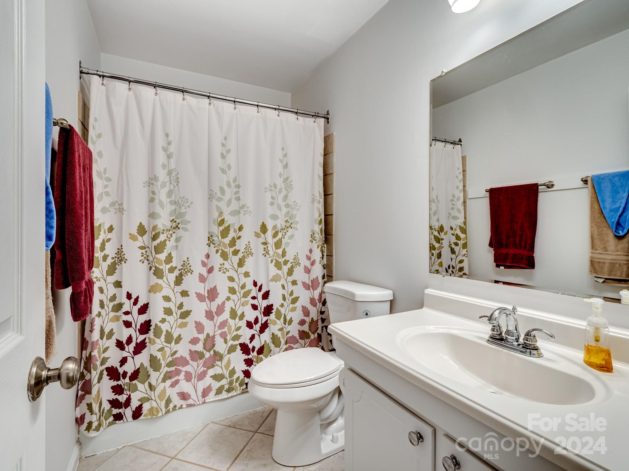 6306 Old Pineville Road, Unit B Charlotte, NC 28217 - Photo 12 of 16 a bathroom with a sink toilet and shower