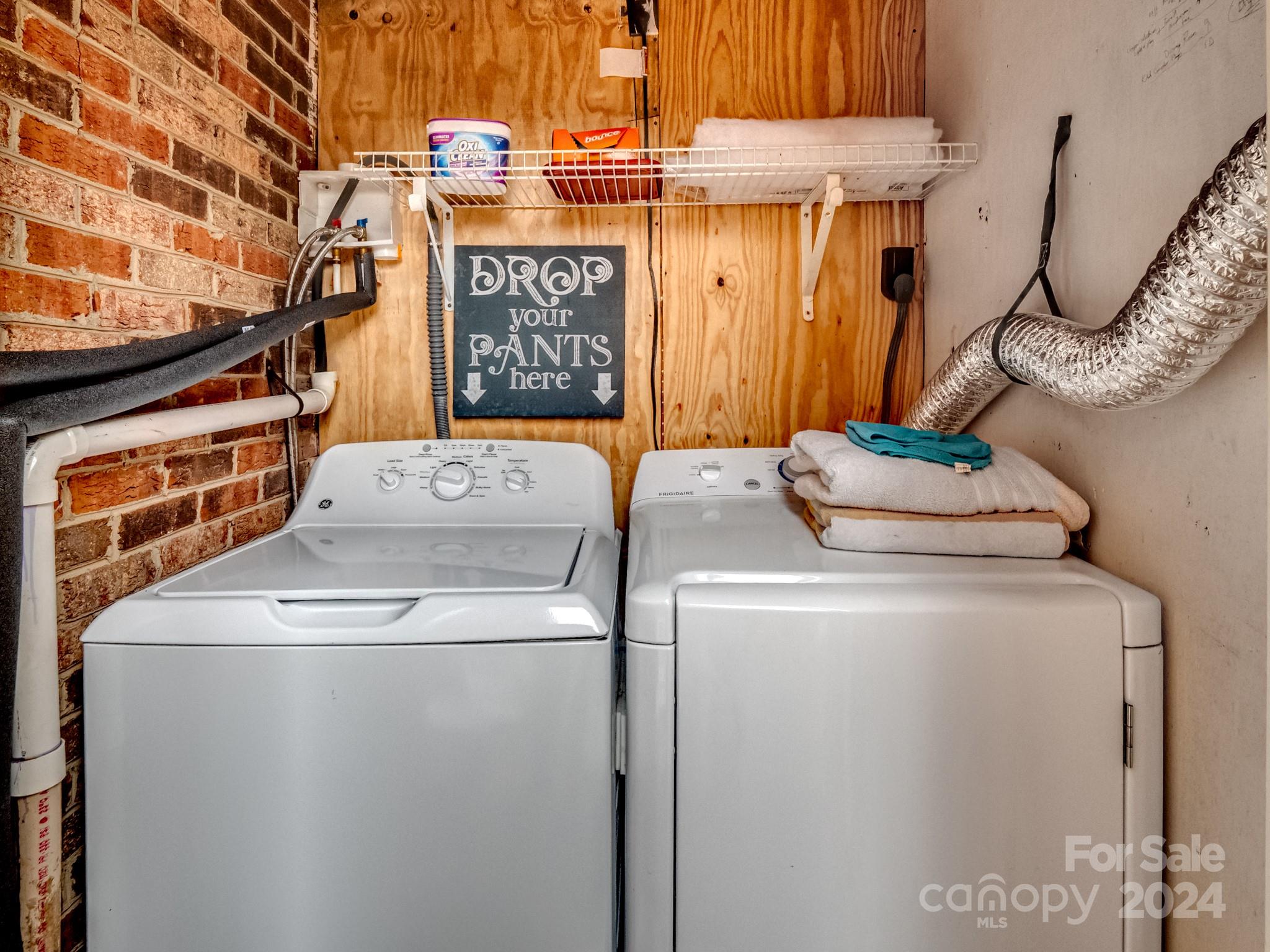 6306 Old Pineville Road, Unit B Charlotte, NC 28217 - Photo 13 of 16 a utility room with dryer and washer