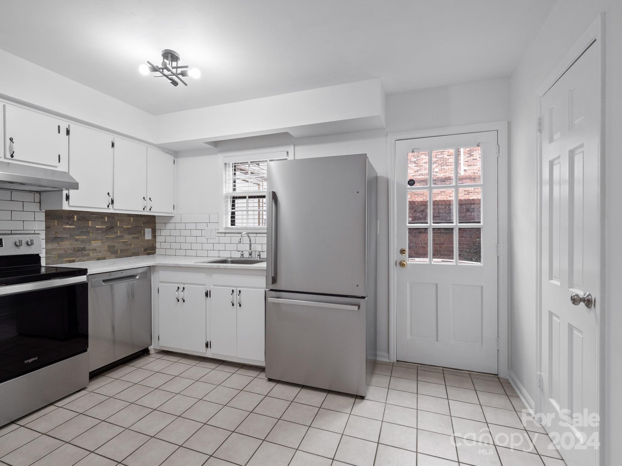 6306 Old Pineville Road, Unit B Charlotte, NC 28217 - Photo 3 of 16 a kitchen with cabinets and appliances
