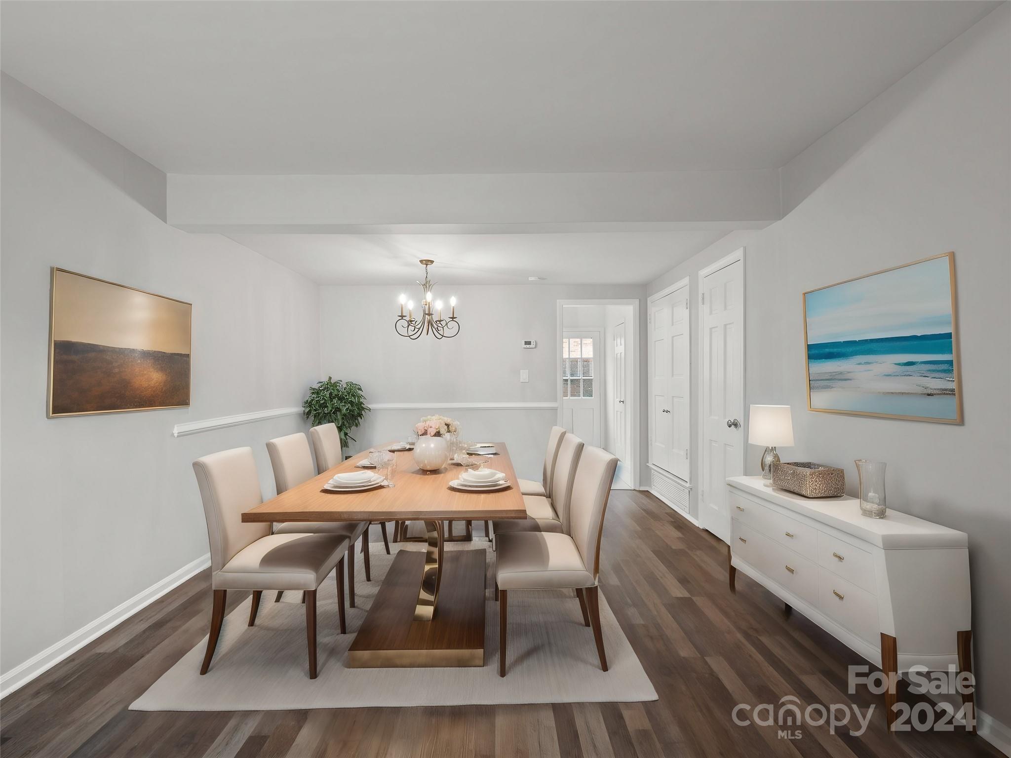 6306 Old Pineville Road, Unit B Charlotte, NC 28217 - Photo 5 of 16 a view of a dining room with furniture and wooden floor