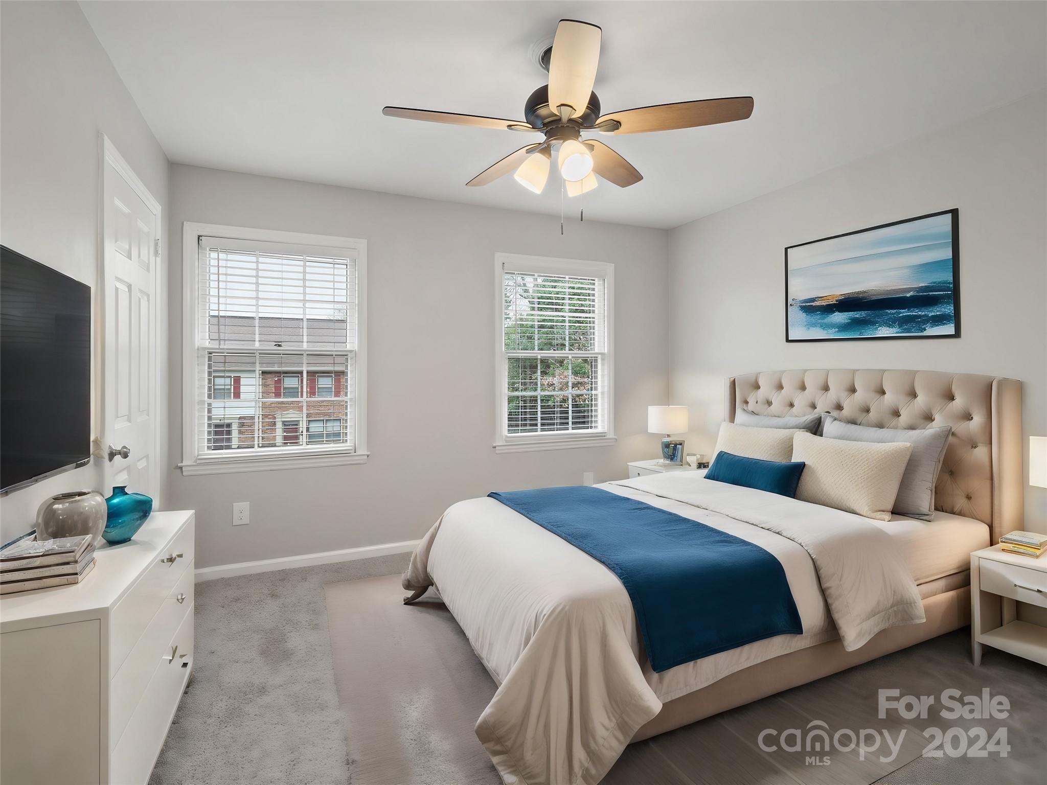 6306 Old Pineville Road, Unit B Charlotte, NC 28217 - Photo 10 of 16 a bedroom with a bed and a flat screen tv