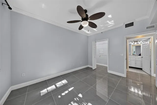 a bathroom with a granite countertop sink a mirror and shower