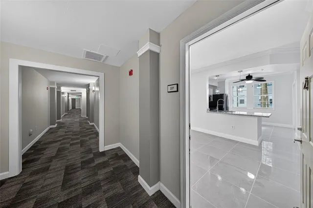 a kitchen with stainless steel appliances granite countertop a sink refrigerator and microwave