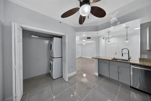 a view of a kitchen with a sink and a window