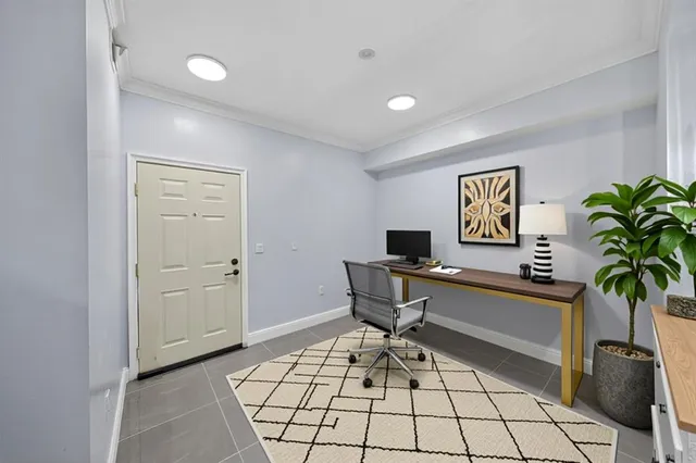 a bedroom with a bed potted plant and a window