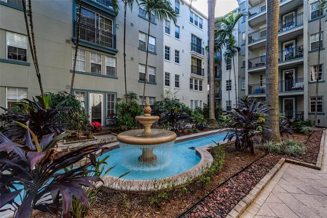 a lobby with furniture and a flat screen tv
