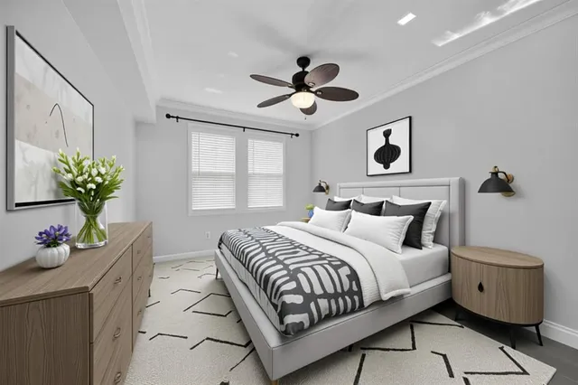 a bathroom with a granite countertop sink a toilet a mirror a bathtub and shower