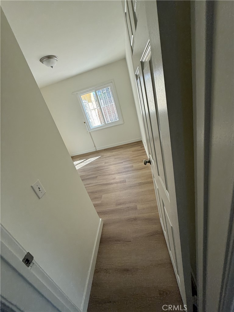 13716 Goleta Street Arleta, CA 91331 - Photo 13 of 28 a view of staircase with wooden floor and window