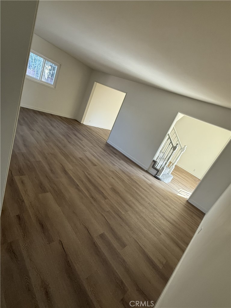 13716 Goleta Street Arleta, CA 91331 - Photo 2 of 28 a view of an empty room with wooden floor and a window