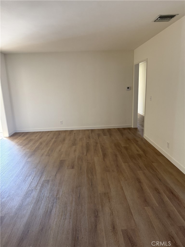 13716 Goleta Street Arleta, CA 91331 - Photo 23 of 28 a view of an empty room with wooden floor