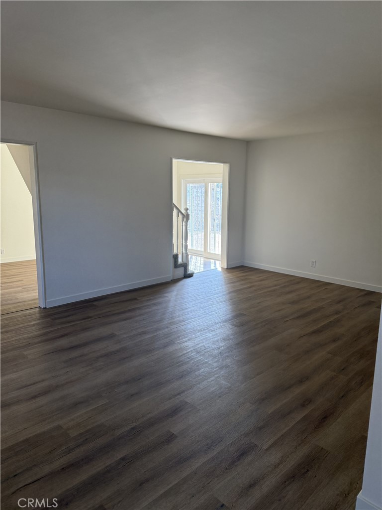 13716 Goleta Street Arleta, CA 91331 - Photo 24 of 28 a view of an empty room with wooden floor and a window