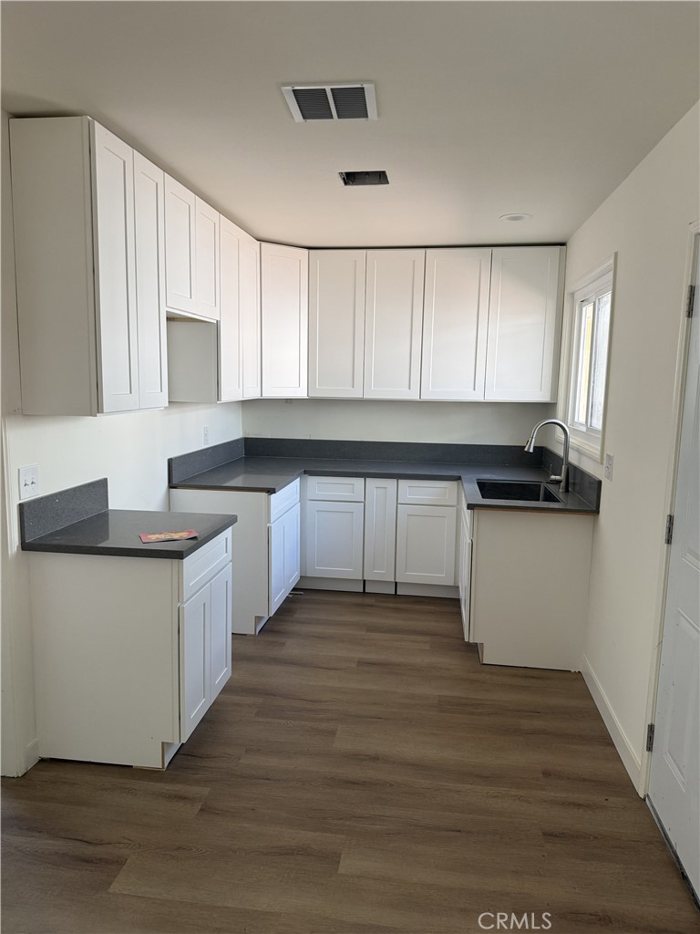 13716 Goleta Street Arleta, CA 91331 - Photo 26 of 28 a kitchen with granite countertop a sink and cabinets