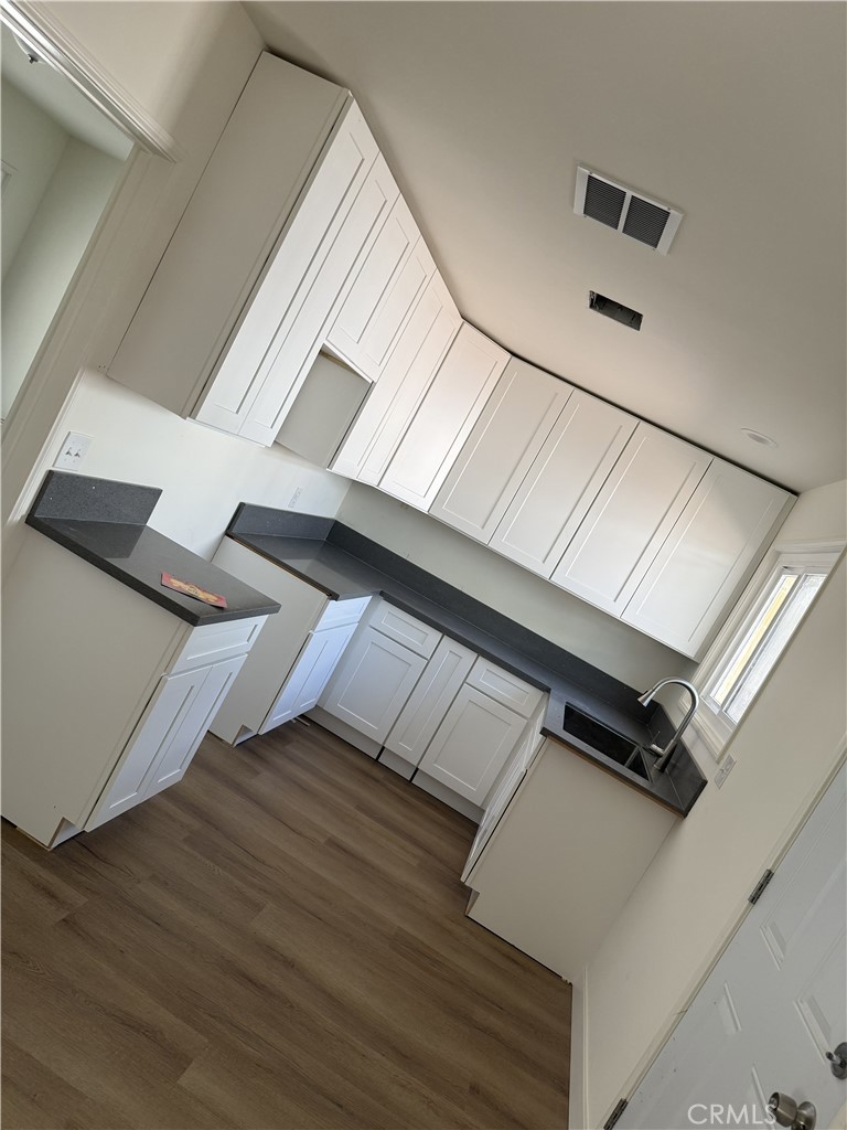 13716 Goleta Street Arleta, CA 91331 - Photo 28 of 28 a view of an empty room with wooden floor
