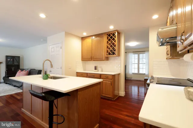 a kitchen with a stove and a refrigerator