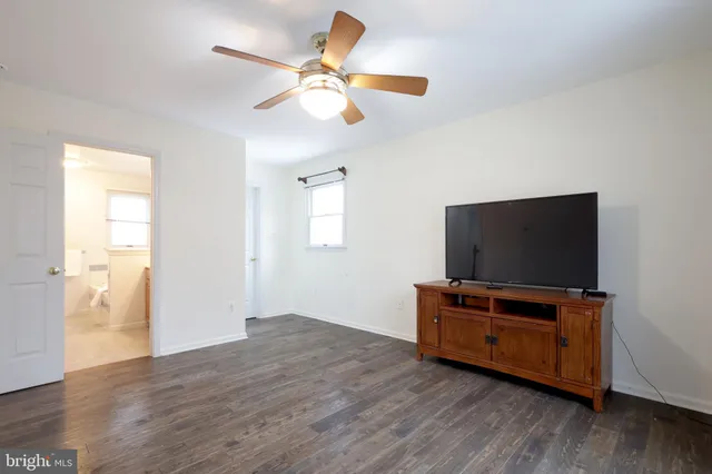 an empty room with wooden floor