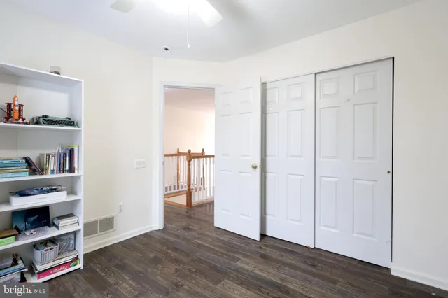 a bathroom with a sink toilet and mirror
