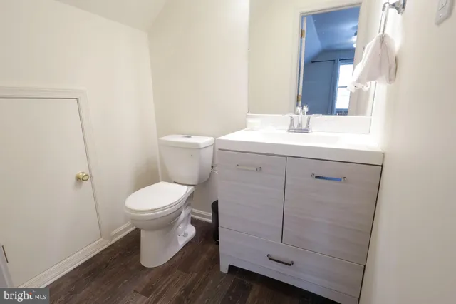 a front view of a house with a wooden fence