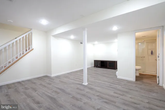 a view of a roof deck with wooden fence and floor