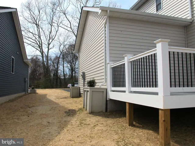 a kitchen with white cabinets stainless steel appliances and sink