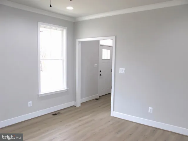 a white toilet sitting next to a bath tub
