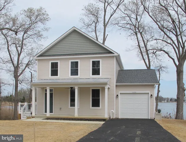 a view of lake with green space