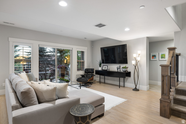 1737 East Viewside Circle Hideout, UT 84036 - Photo 17 of 35 Spacious living area featuring light wood-finish flooring, recessed lighting, and a sliding glass door providing access to an exterior patio