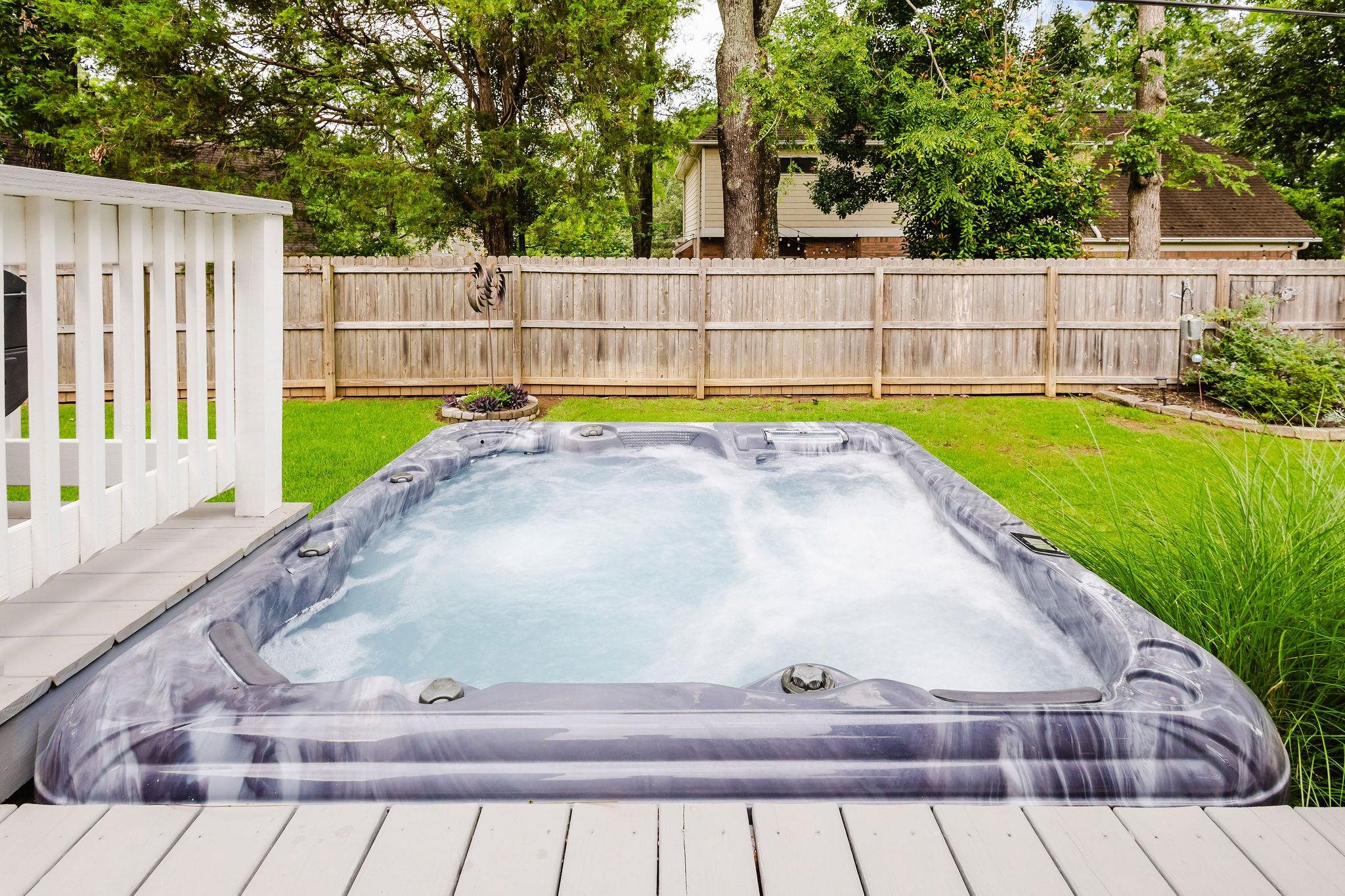 305 Great Falls Road Collierville, TN 38017 - Photo 21 of 23 Backyard featuring an integrated hot tub and an expansive wooden deck