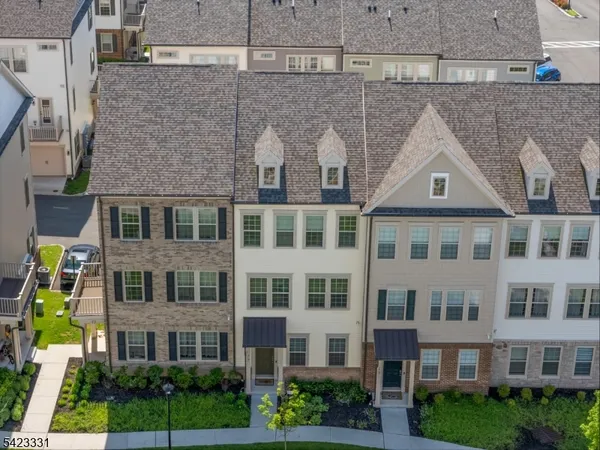 a front view of a building with garden