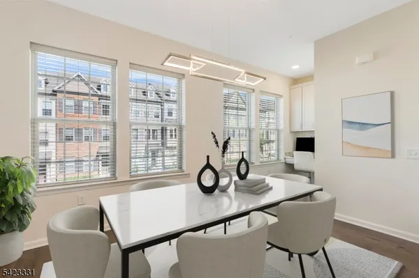 a view of a livingroom with furniture and windows