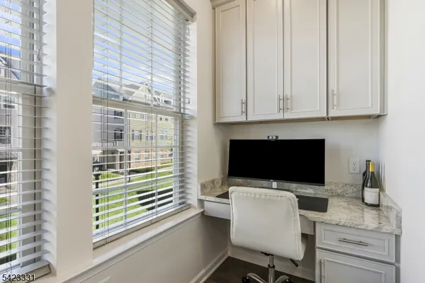 a room with a chair and a flat screen tv
