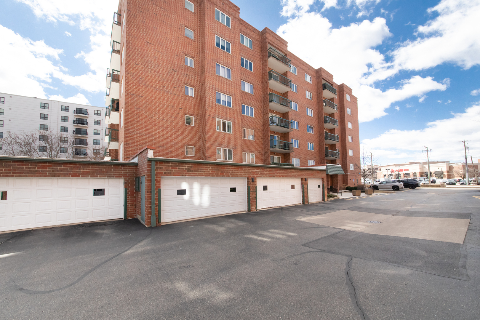 555 South River Road, Unit 607 Des Plaines, IL 60016 - Photo 18 of 22 a large building with a large windows