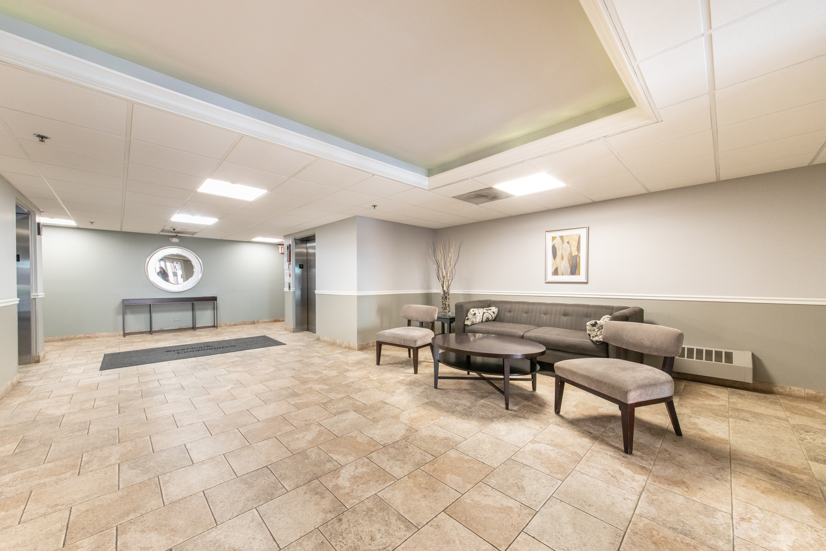 555 South River Road, Unit 607 Des Plaines, IL 60016 - Photo 3 of 22 a living room with furniture and a table