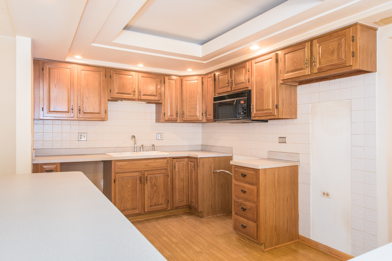555 South River Road, Unit 607 Des Plaines, IL 60016 - Photo 5 of 22 a kitchen with stainless steel appliances granite countertop a sink and cabinets
