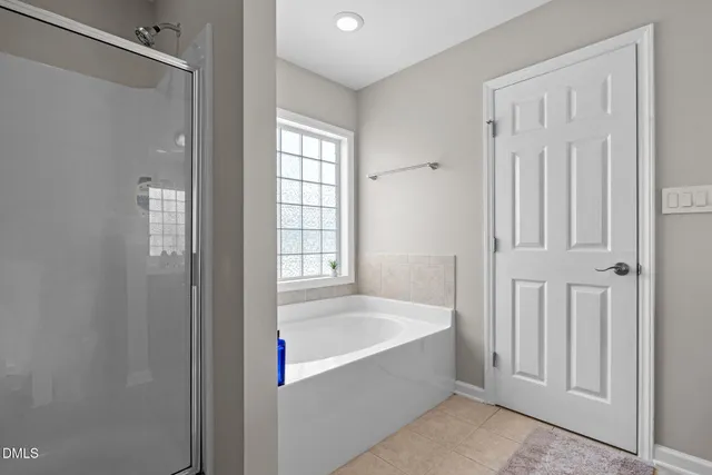 a view of a livingroom with a ceiling fan and window