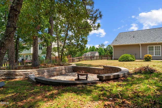 a view of a fountain in the backyard of house