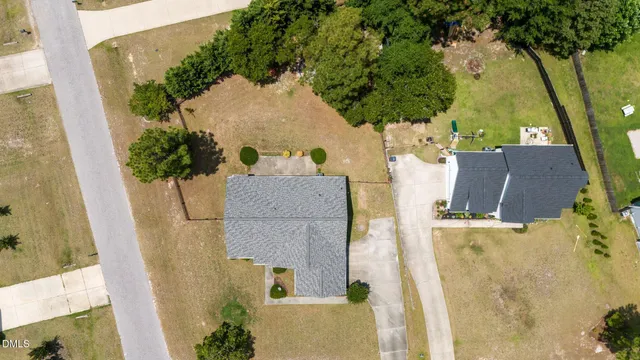 an aerial view of a house with a swimming pool