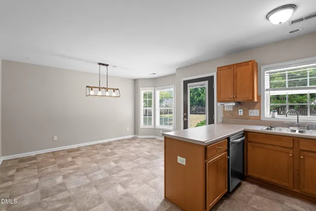 a kitchen with sink and window