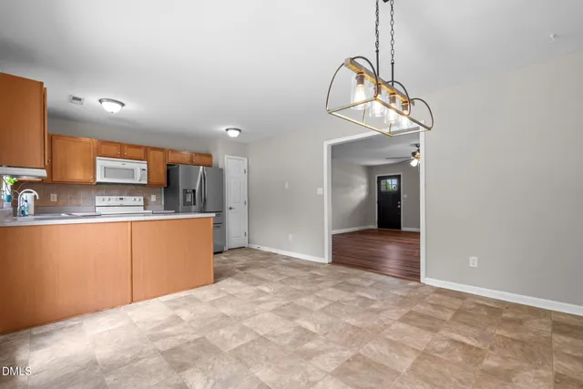 a view of a kitchen with a sink and cabinet area
