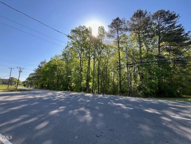 4300-4304 Cheek Road Durham, NC 27704 - Photo 18 of 27 a view of a field with trees in the background
