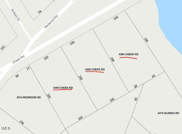 4300-4304 Cheek Road Durham, NC 27704 - Photo 24 of 27 a hallway with white cabinets and white appliances