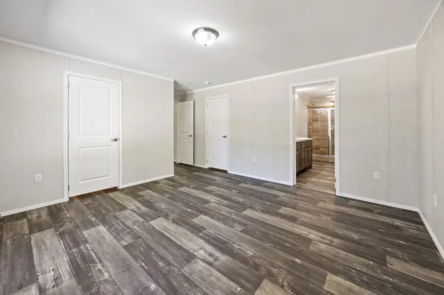 a view of a livingroom with wooden floor and closet