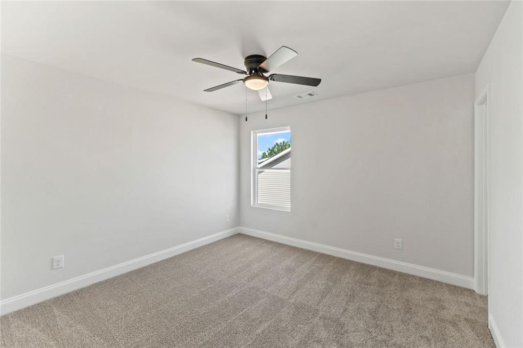769 Dawn Place Alto, GA 30510 - Photo 25 of 40 an empty room with windows and fan