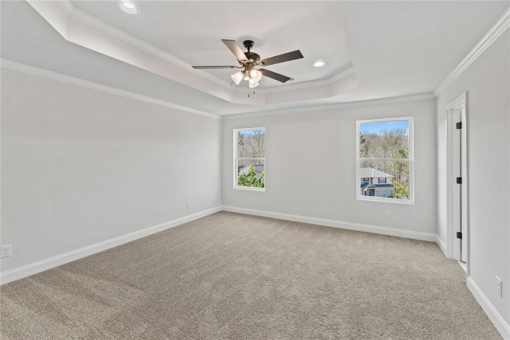 769 Dawn Place Alto, GA 30510 - Photo 31 of 40 an empty room with window and ceiling fan