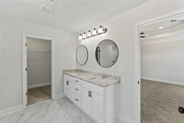 a view of cabinets mirror and wooden floor