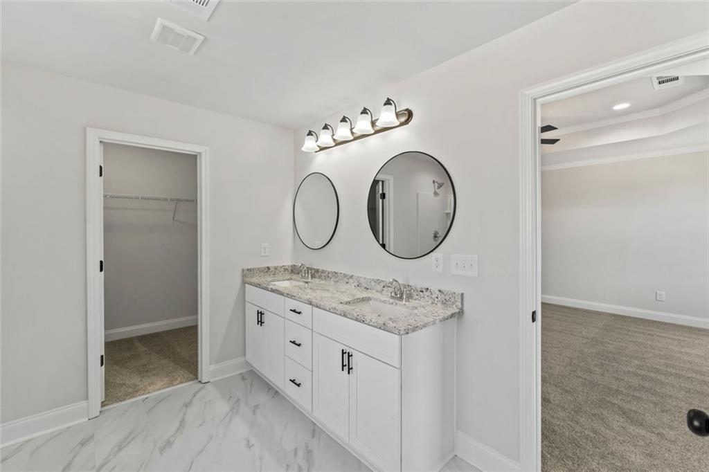 769 Dawn Place Alto, GA 30510 - Photo 34 of 40 a view of cabinets mirror and wooden floor